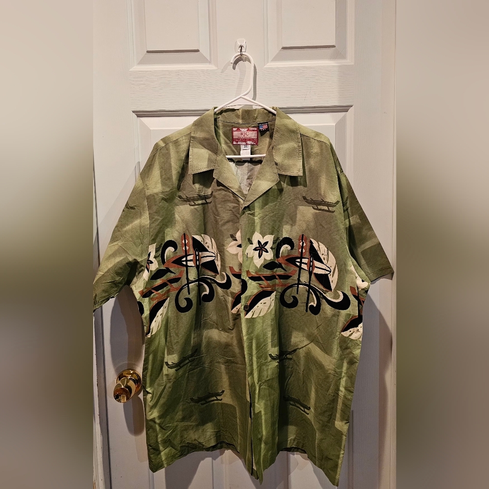 SOLD ~ RJC Hawaiian aloha shirt in a green color with a boat/canoe and floral